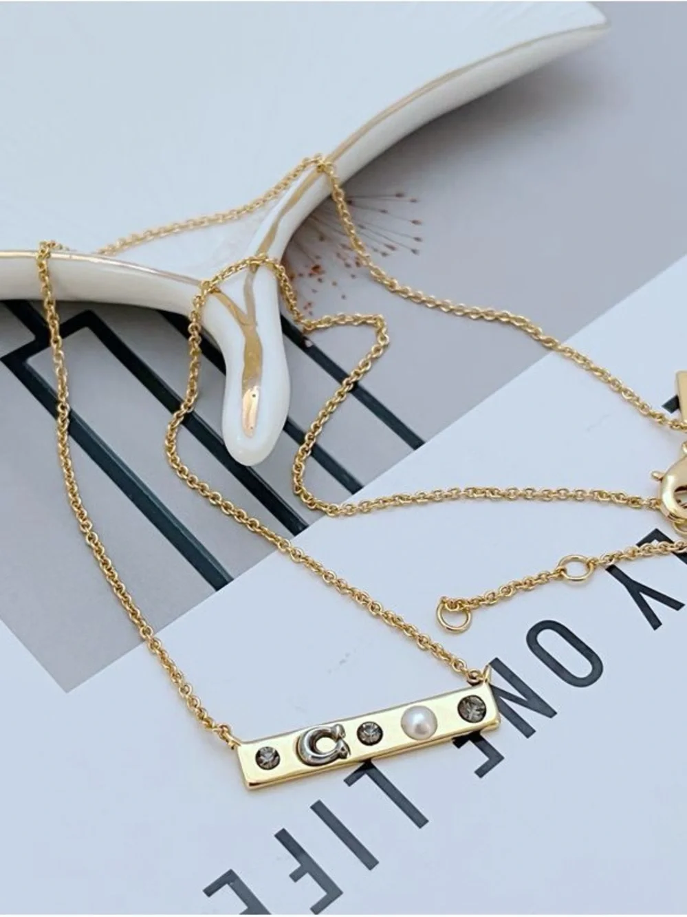 Coach Gold-Tone Bar Necklace with Crystal and Pearl Accents - Picture 4 of 5